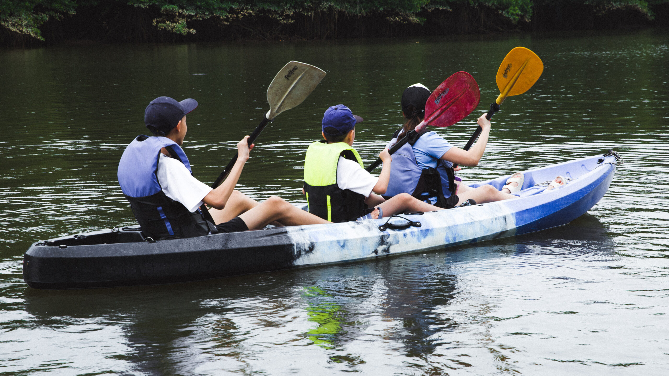 Children kayaking on a family outing